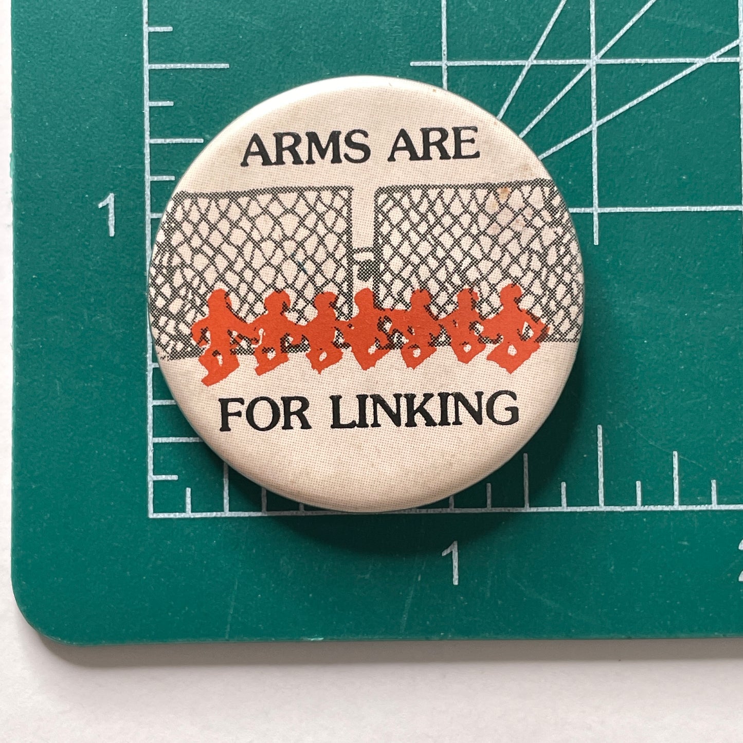Arms Are For Linking Donnelly/Colt Anti-War 70s Vintage Pinback Button 1.5"